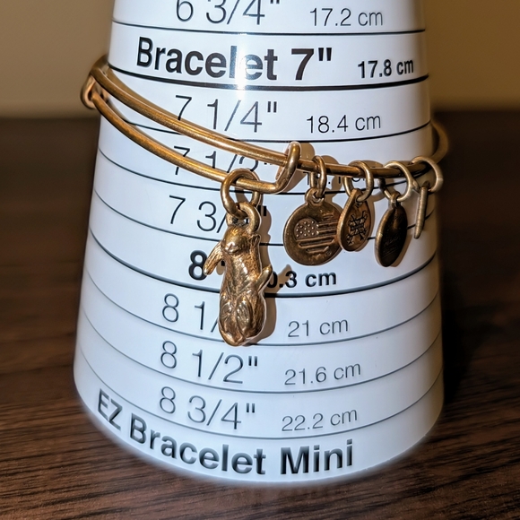 Alex and Ani Cat on its back playing Charm Bangle Expandable - Picture 3 of 6